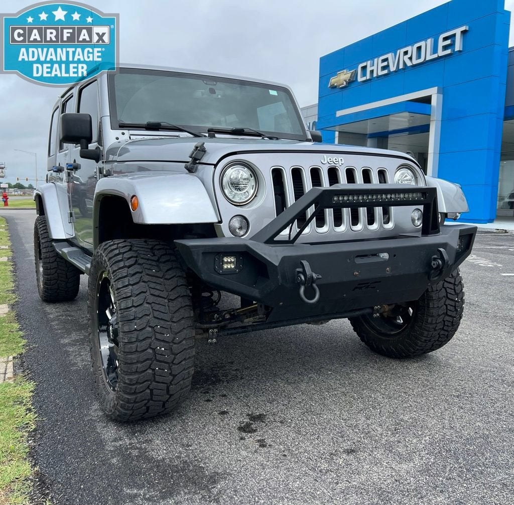2018 Jeep Wrangler JK Unlimited Sahara in Silver — front three-quarter view