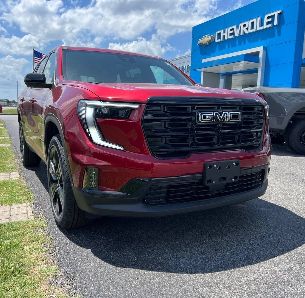 2026 GMC Acadia Elevation in Volcanic Red Tintcoat — front three-quarter view