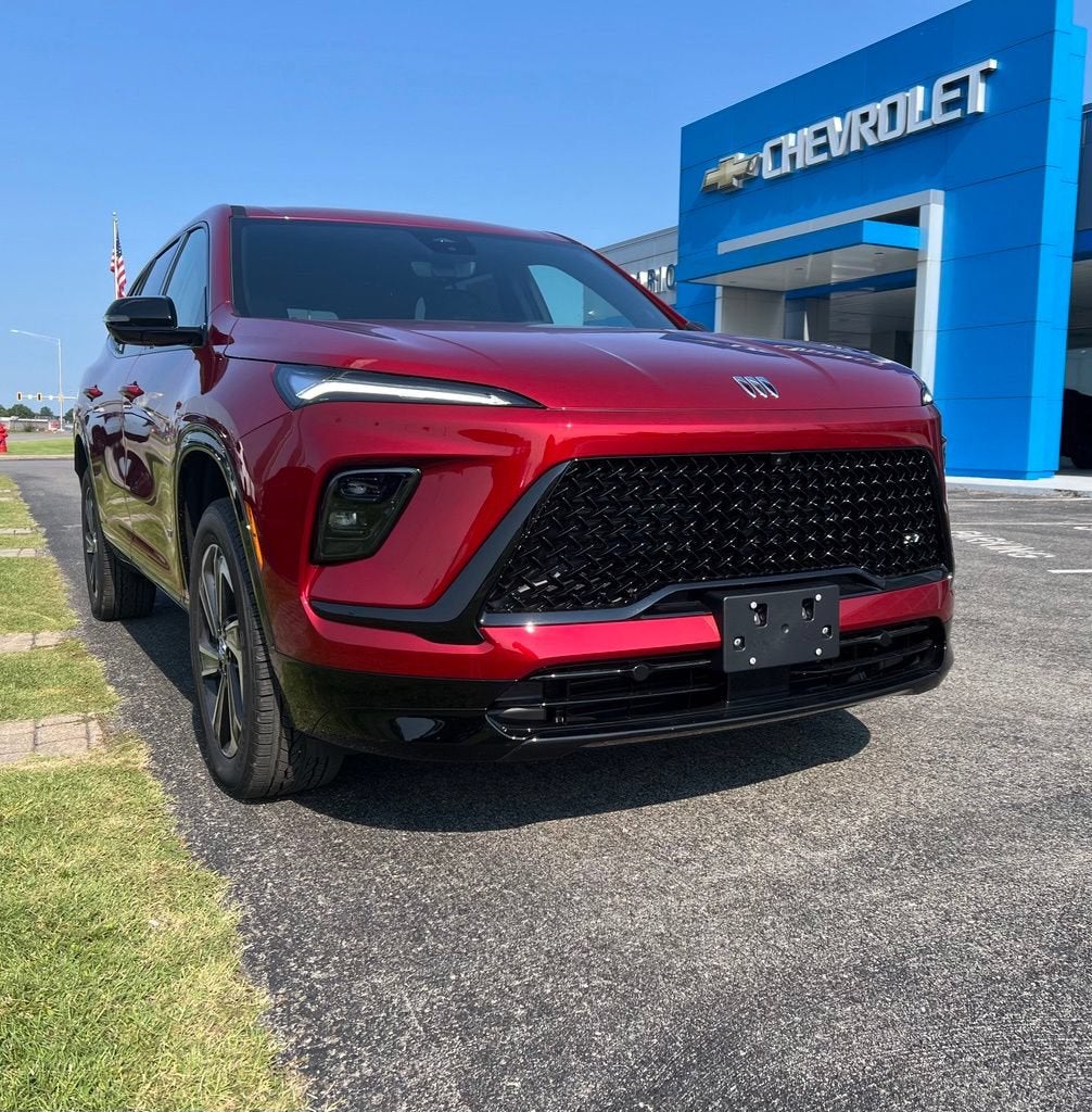 2026 Buick Enclave Sport Touring in Cherry Red Tintcoat — front three-quarter view